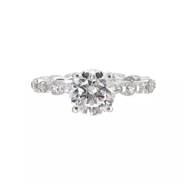 You are sure to cause a sensation with marqusie and round diamonds engagement ring highlighting the center solitaire.
